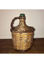 Old Dame Jeanne covered with wicker | Dame Jeanne vintage