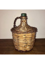 Old Dame Jeanne covered with wicker | Dame Jeanne vintage