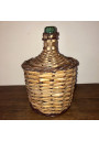 Old Dame Jeanne covered with wicker | Dame Jeanne vintage