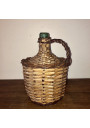 Old Dame Jeanne covered with wicker | Dame Jeanne vintage