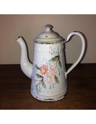Old coffee maker in white enamelled sheet metal with floral decoration in relief