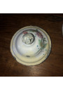 Old coffee maker in white enamelled sheet metal with floral decoration in relief