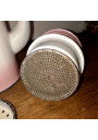 Old coffee maker in pink and white enamelled sheet metal