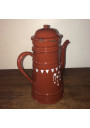 Old coffee maker in brown and white enamelled sheet metal