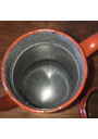 Old coffee maker in brown and white enamelled sheet metal