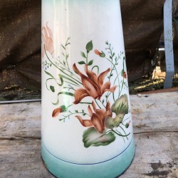 Old large water pitcher in white and green enamelled sheet metal with floral decoration