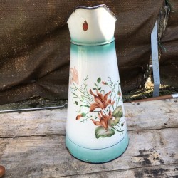 Old large water pitcher in white and green enamelled sheet metal with floral decoration