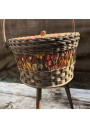 Old small vintage worker in rattan and floral fabric