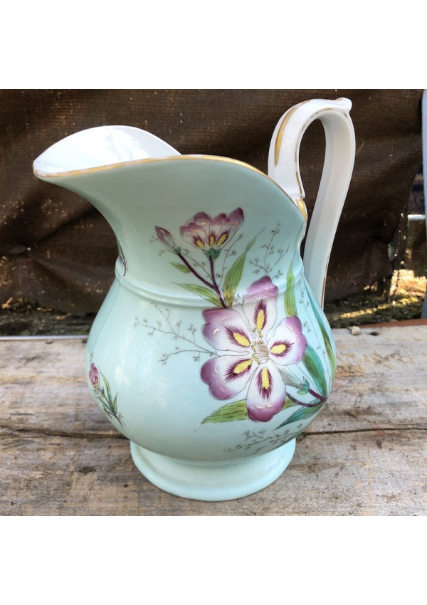 Old porcelain toilet pitcher