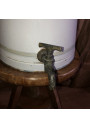 Very large and old coffee maker with enamelled sheet metal faucet