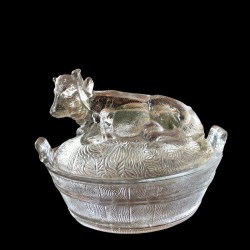 Old glass butter dish representing a cow on the lid