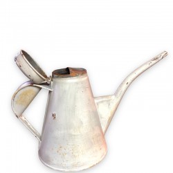 Old small sheet metal watering can with lid