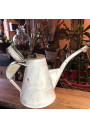 Old small sheet metal watering can with lid