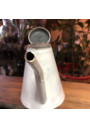 Old small sheet metal watering can with lid