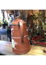 Old coffee maker in brown enamelled sheet metal with embossed floral decoration