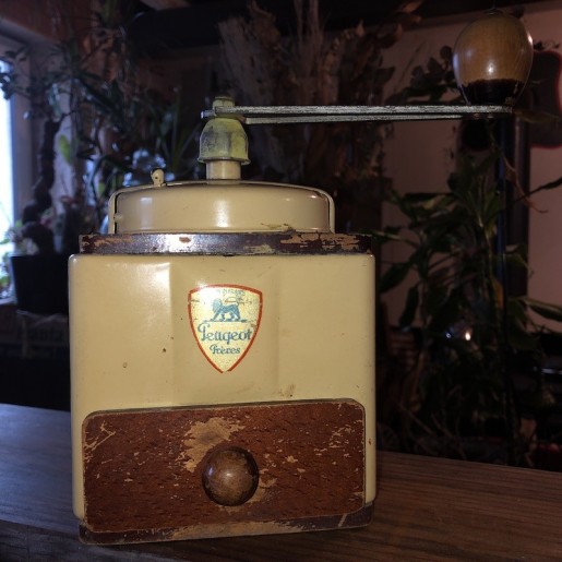 Old cream colored Peugeot Frères coffee grinder