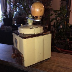 Old cream colored Peugeot Frères coffee grinder