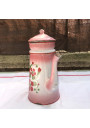 Old coffee maker in pink and white enamelled sheet metal with floral decoration
