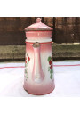 Old coffee maker in pink and white enamelled sheet metal with floral decoration