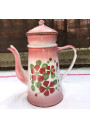 Old coffee maker in pink and white enamelled sheet metal with floral decoration