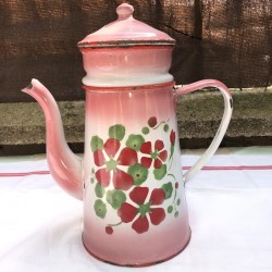 Old coffee maker in pink and white enamelled sheet metal with floral decoration