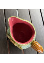 Old small pitcher in dabbling lion decor