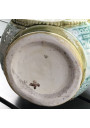 Old small pitcher in dabbling lion decor