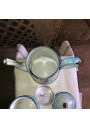 Old enameled sheet metal coffee maker decorated with pansies