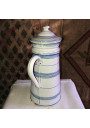Old coffee maker in enameled sheet metal with blue and gold stripes