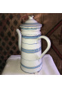 Old coffee maker in enameled sheet metal with blue and gold stripes