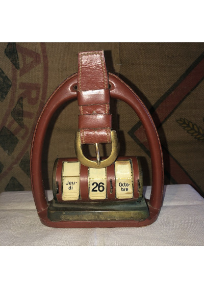 Old perpetual calendar with leather and brass stirrup