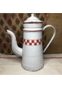 Old coffee maker in white enameled sheet metal with red checkerboard