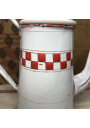 Old coffee maker in white enameled sheet metal with red checkerboard