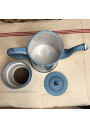 Old coffee maker in blue and white checkered enameled sheet metal