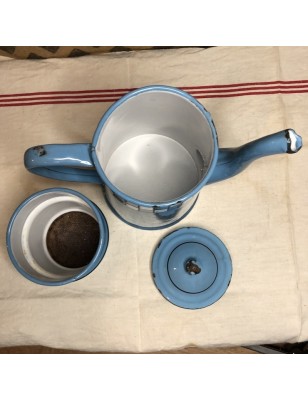 Old coffee maker in blue and white checkered enameled sheet metal