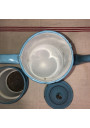 Old coffee maker in blue and white checkered enameled sheet metal