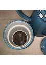Old coffee maker in blue and white checkered enameled sheet metal