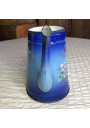 Old enameled sheet metal coffee pot with floral and boat decoration
