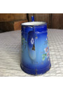 Old enameled sheet metal coffee pot with floral and boat decoration