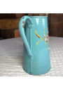 Ancienne cafetière en tôle émaillée bleue décor floral en relièf