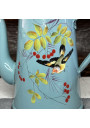 Old enameled metal coffee pot with bird and cherry decor