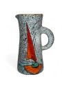 Old pitcher with black and white granite decoration and sailboat
