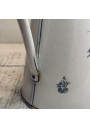 Old enamelled sheet metal pitcher with blue floral decoration on a white background