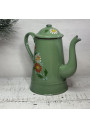 Old coffee pot in green enameled sheet metal with floral decoration in relief