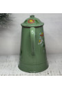 Old coffee pot in green enameled sheet metal with floral decoration in relief