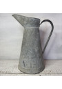 Old large galvanized metal jug