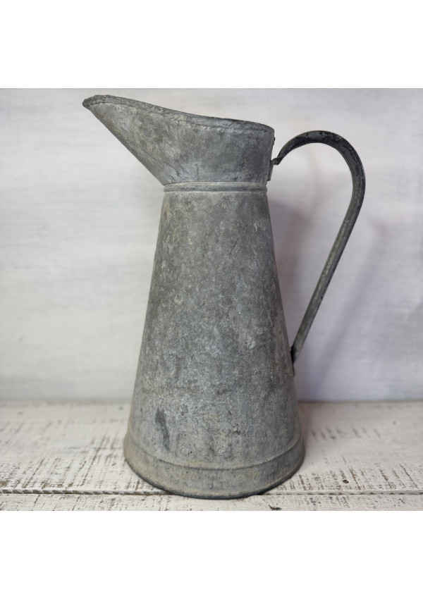 Old large galvanized metal jug
