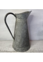 Old large galvanized metal jug