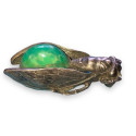 Antique cicada brooch with green stone cabochon