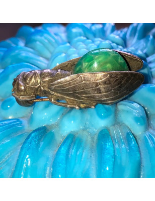 Antique cicada brooch with green stone cabochon